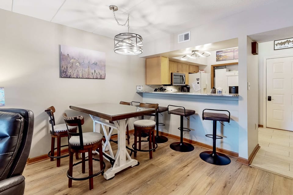 Modern vibe with chic seating and a scenic view for delightful meals together.