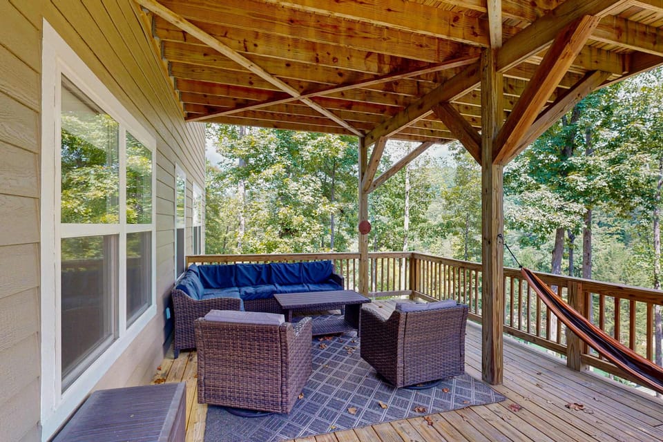 Lounge and unwind amidst nature with comfy seating and tree-top views!