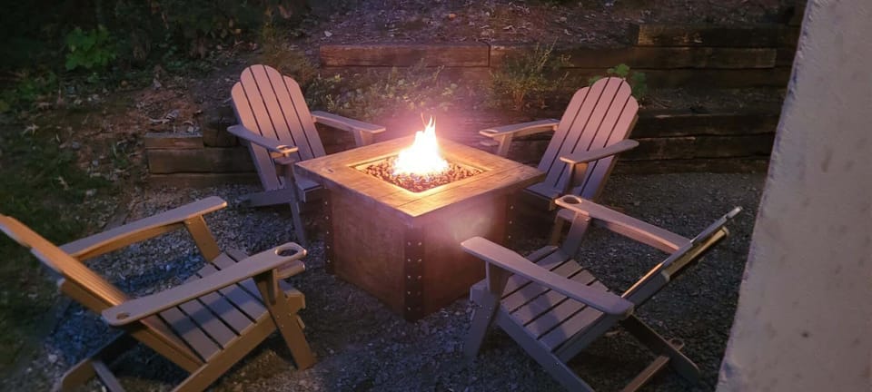 Fire Pit Oasis:, share stories and s'mores by the glow of the fire in nature's embrace!