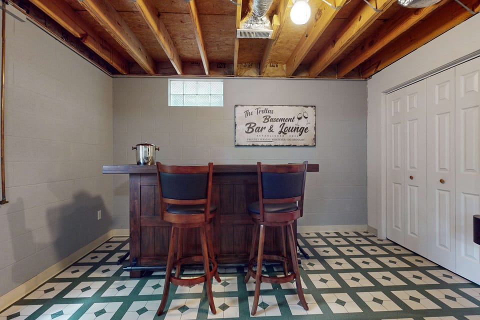 Basement Bar & Lounge awaits! Sip and unwind in your private hangout, complete with classic charm!