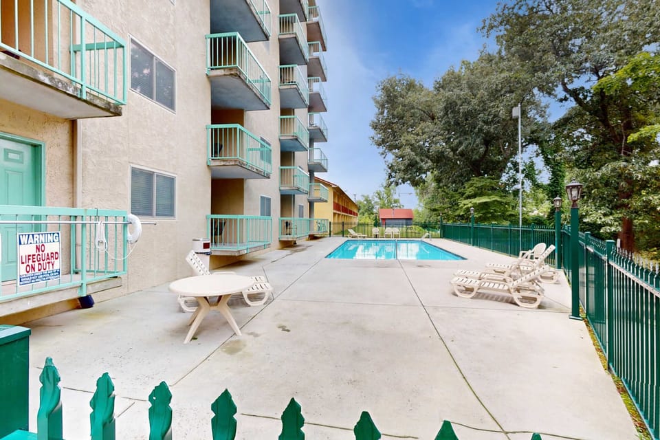 Dive into fun at the sparkling pool, surrounded by lush greenery and sun loungers!