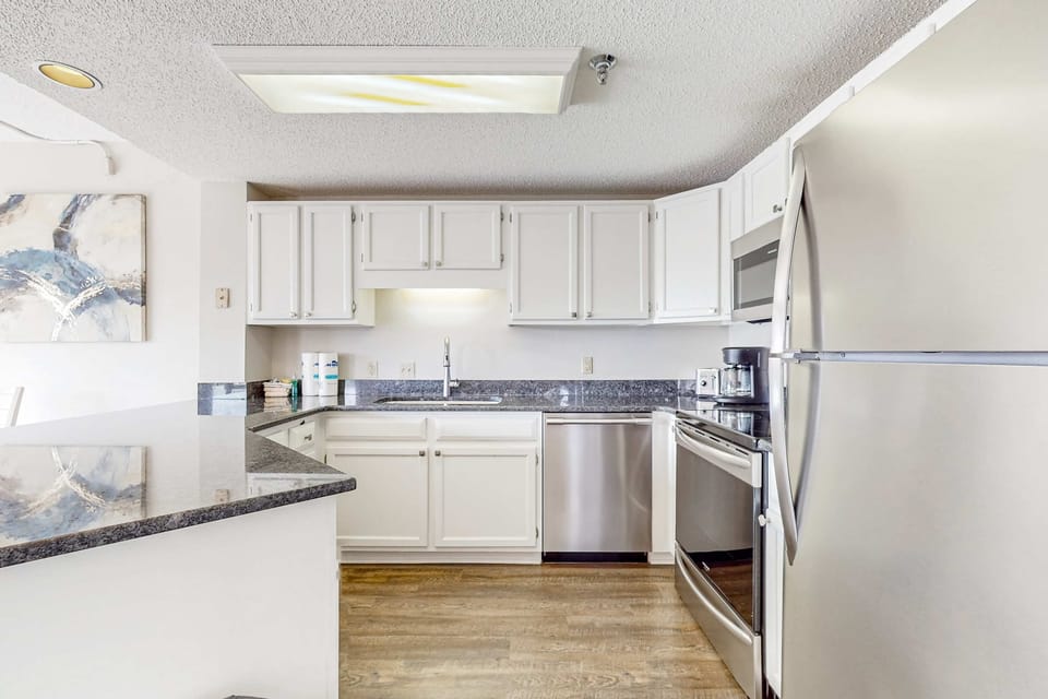 Modern appliances and sleek granite countertops await your culinary adventures!