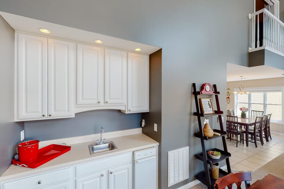 Additional wet bar and prep area with sink and storage. Great for drinks, snacks, and entertaining larger groups.