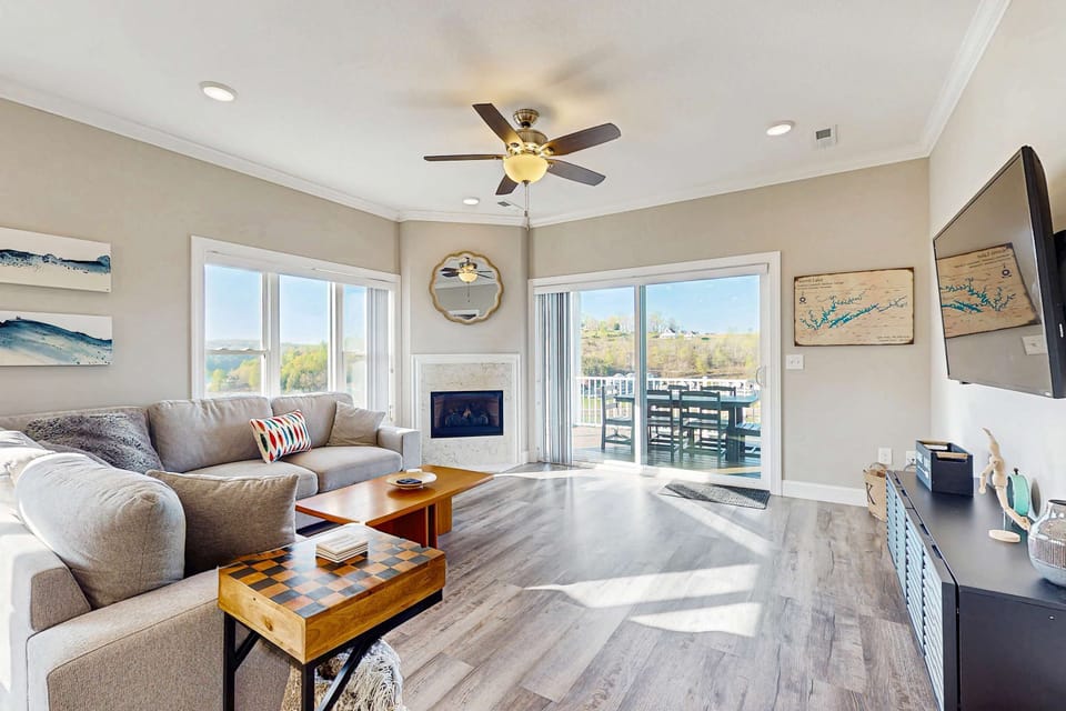 Sunlit space with a fireplace, stunning views, and stylish decor for relaxation!