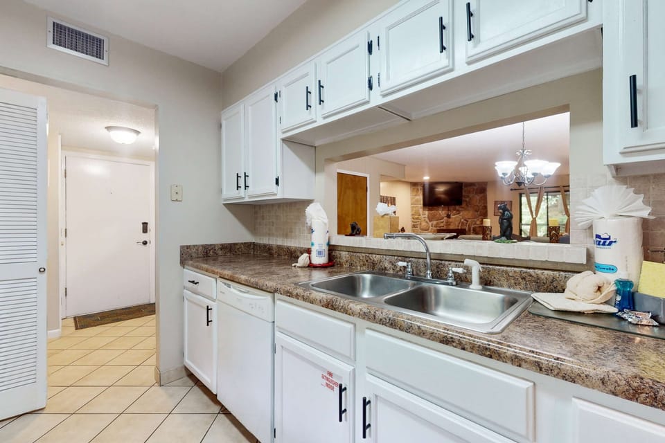 Bright and functional space for culinary adventures with a convenient pass-through!