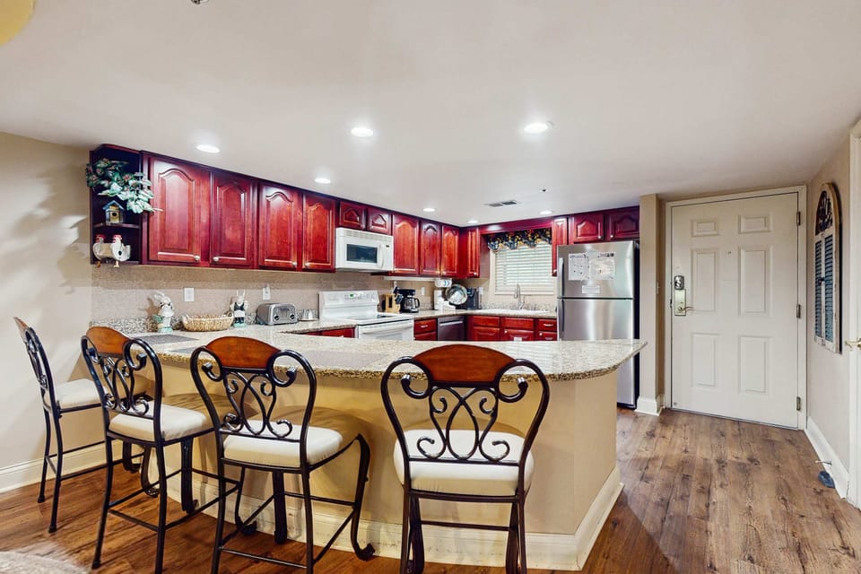 Create culinary masterpieces surrounded by elegant cabinetry and sleek appliances!