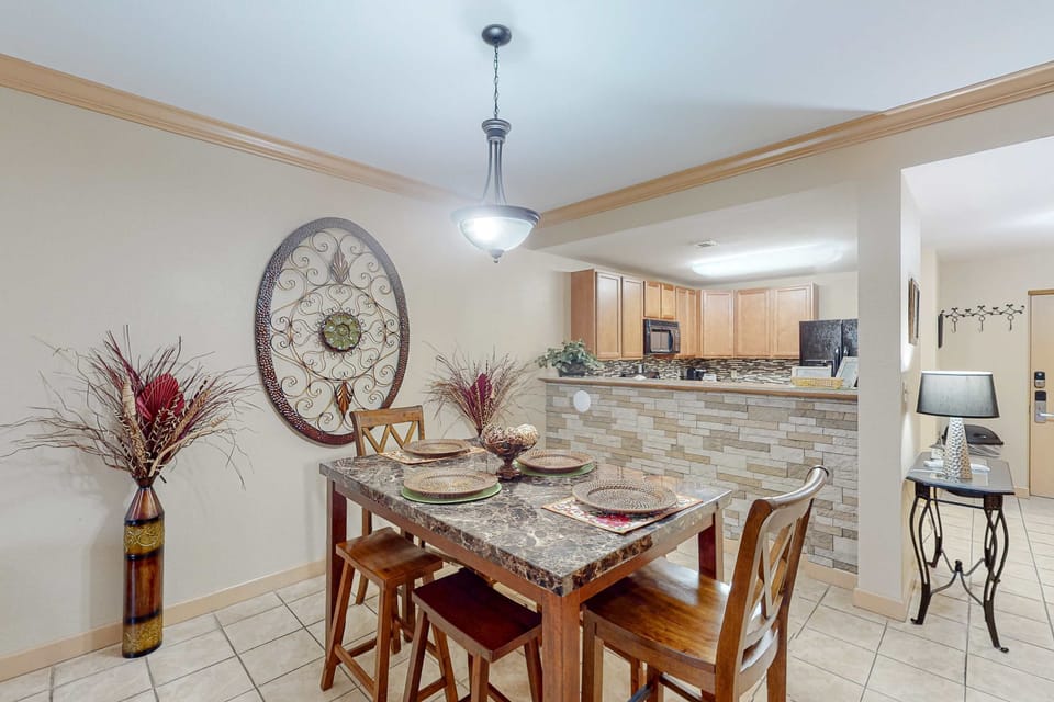 Dining area with table seating for four, perfect for meals, games, and gatherings.