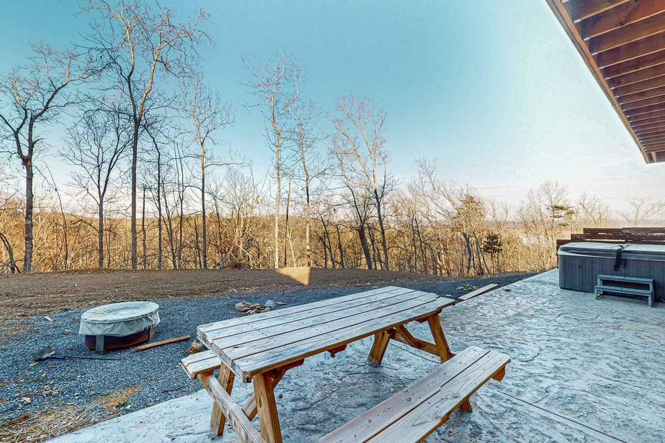 Savor mountain views from this sunlit picnic area, perfect for gatherings!