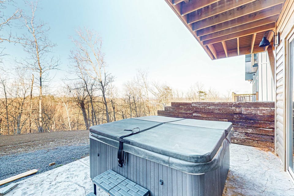 Hot tub retreat awaits. And, unwind with stunning views and soothing bubbles in nature's embrace!