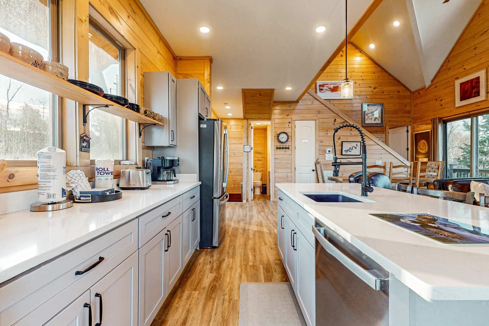 Cook up a storm in this bright, modern kitchen with stunning wood accents!