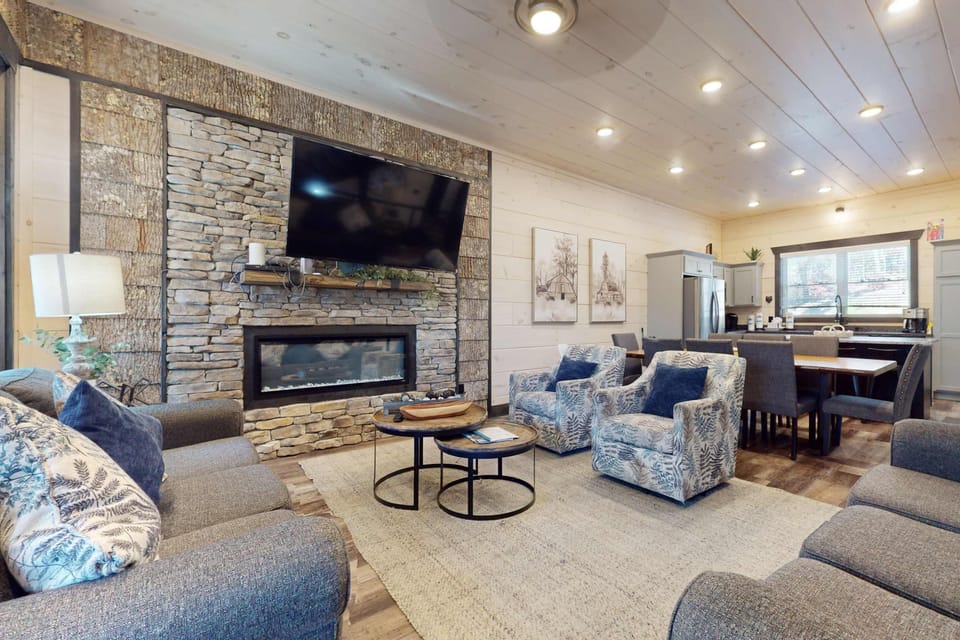 Relax in style with sleek furnishings and a stunning stone fireplace!