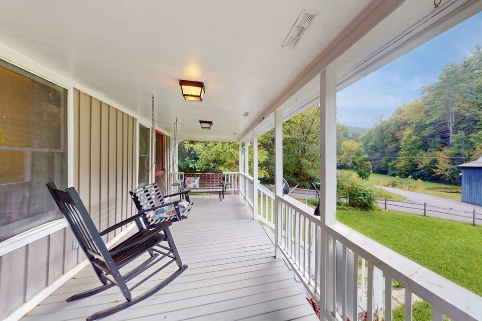 Relaxing porch awaits. And, unwind on rocking chairs with stunning views of lush Tennessee hills!