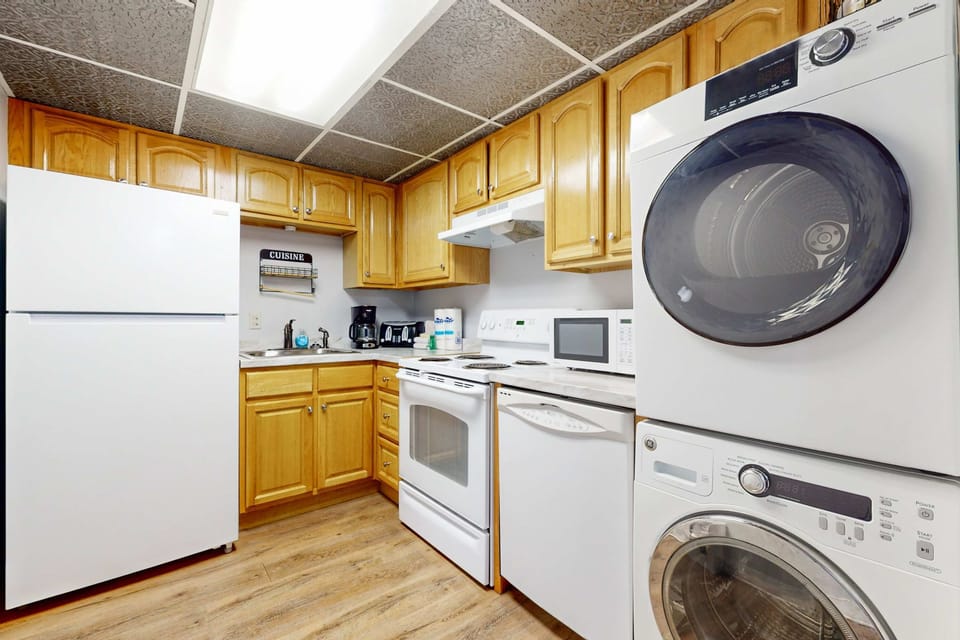 Unleash your culinary skills in this bright space featuring modern appliances and ample storage!
