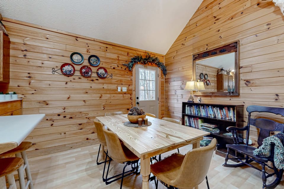 Gather around the rustic table and enjoy views of the serene woods outside!