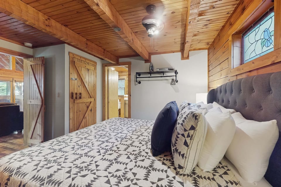 Rustic elegance meets comfort, complete with stunning wood accents and plush bedding!