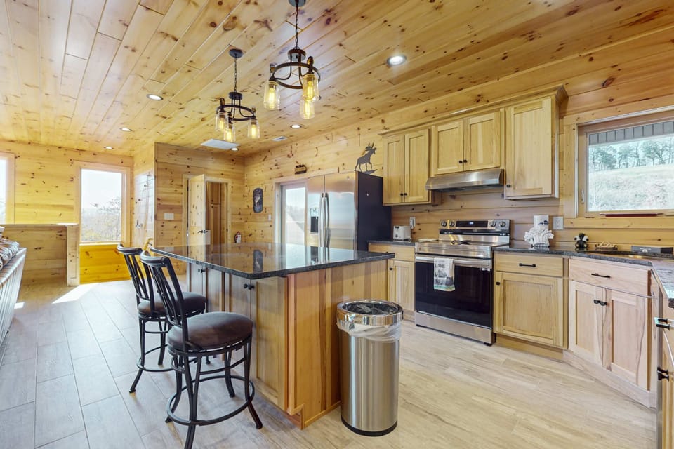 Relax and whip up meals in this bright, spacious kitchen with stunning mountain views!