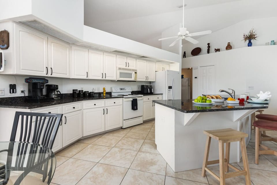 Open-concept kitchen designed for effortless entertaining. Granite counters, ample prep space, and seating for friends and family.