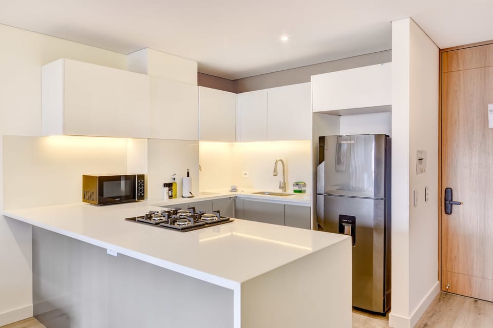 Stylish white kitchen with modern appliances