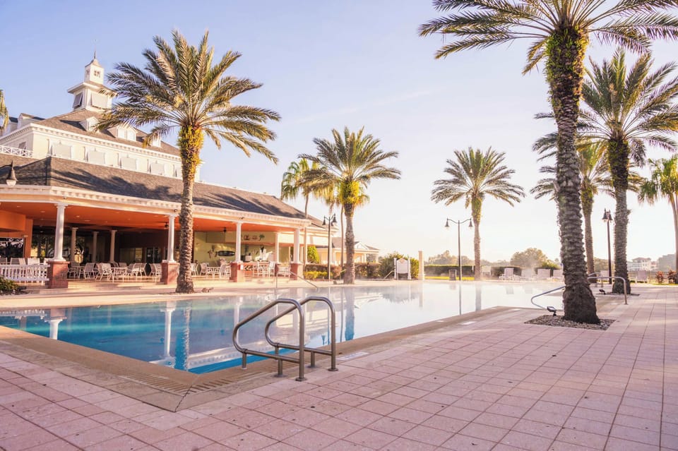 Escape to your own poolside oasis at Reunion Resort, surrounded by sunshine, palm trees, and pure vacation vibes.