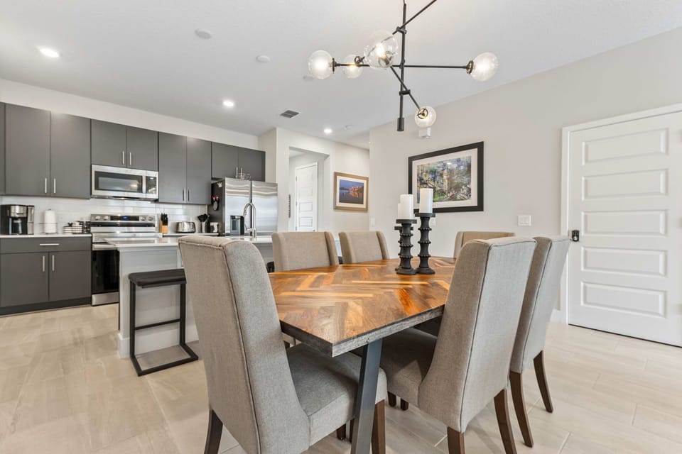 Sleek modern kitchen meets elegant dining – perfect for hosting and creating unforgettable meals in style!