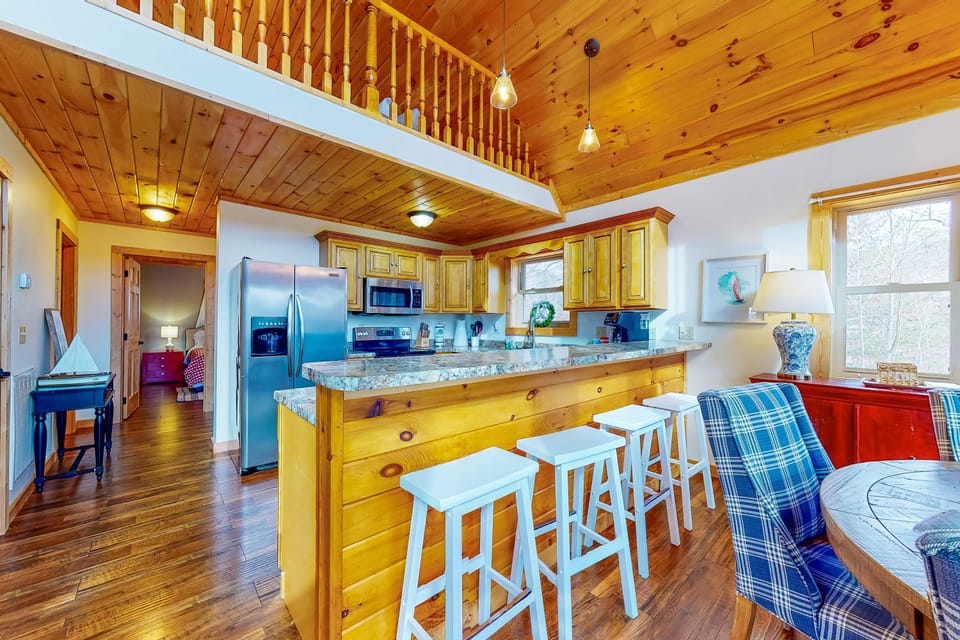 Enjoy culinary adventures with modern appliances and charming wood accents!