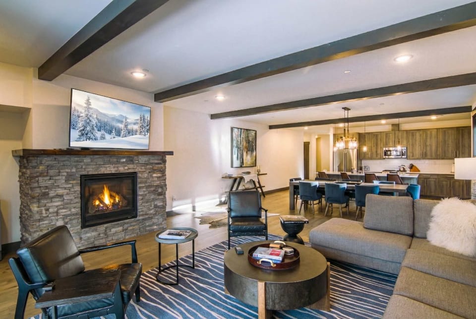 Living Room: Sectional sofa, 60” Samsung Smart TV, gas fireplace, mountain views, deck access