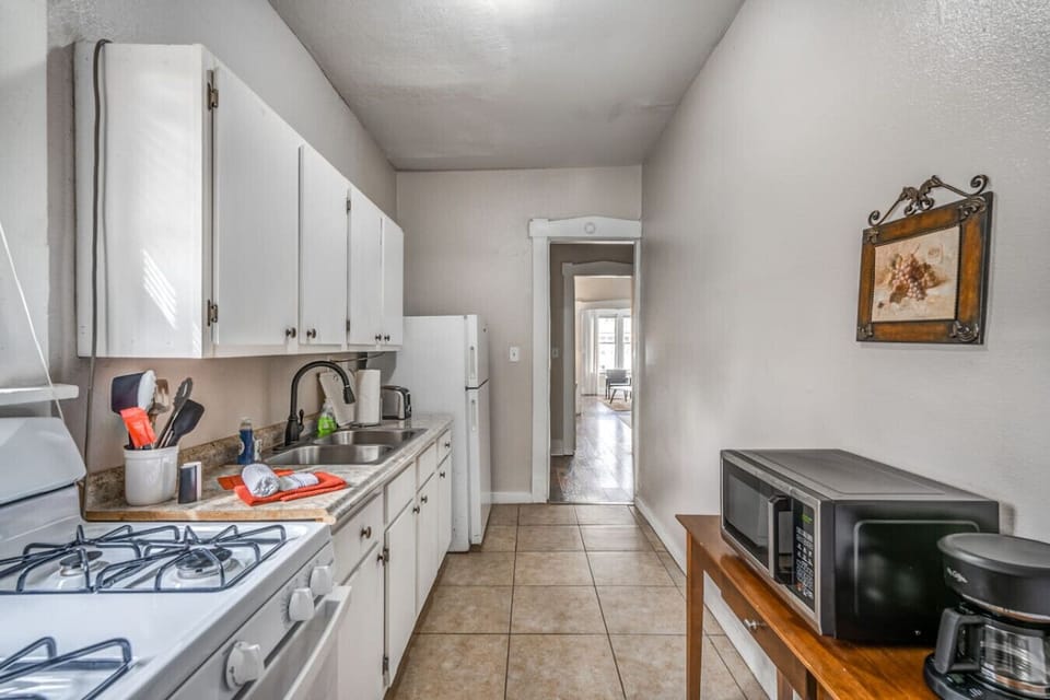 Make yourself at home with a practical kitchen setup ideal for preparing meals or enjoying a relaxed morning coffee.