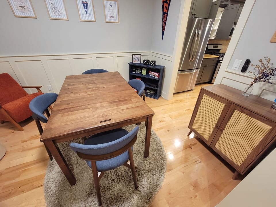 Game room with game table and a large selection of games and puzzles