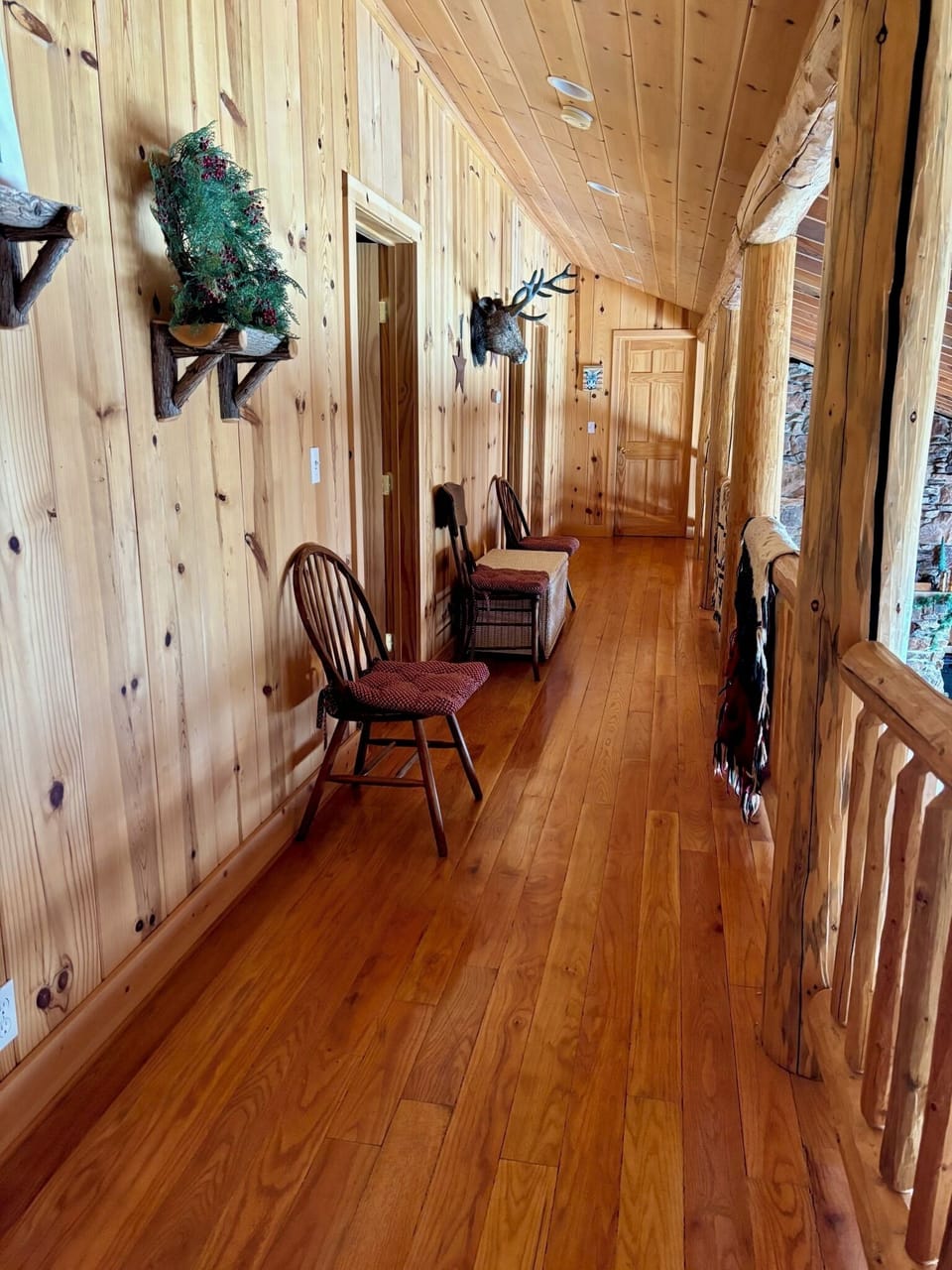 This upstairs hallway leads to the two upstairs bedrooms & bathrooms