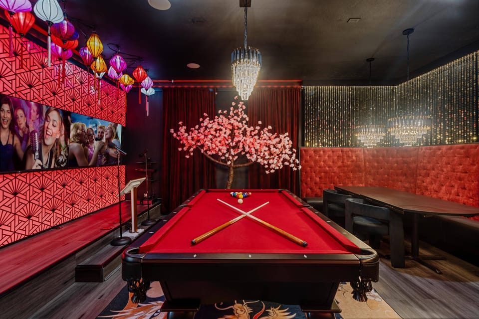 Entertainment area with pool table, karaoke, and mini bar