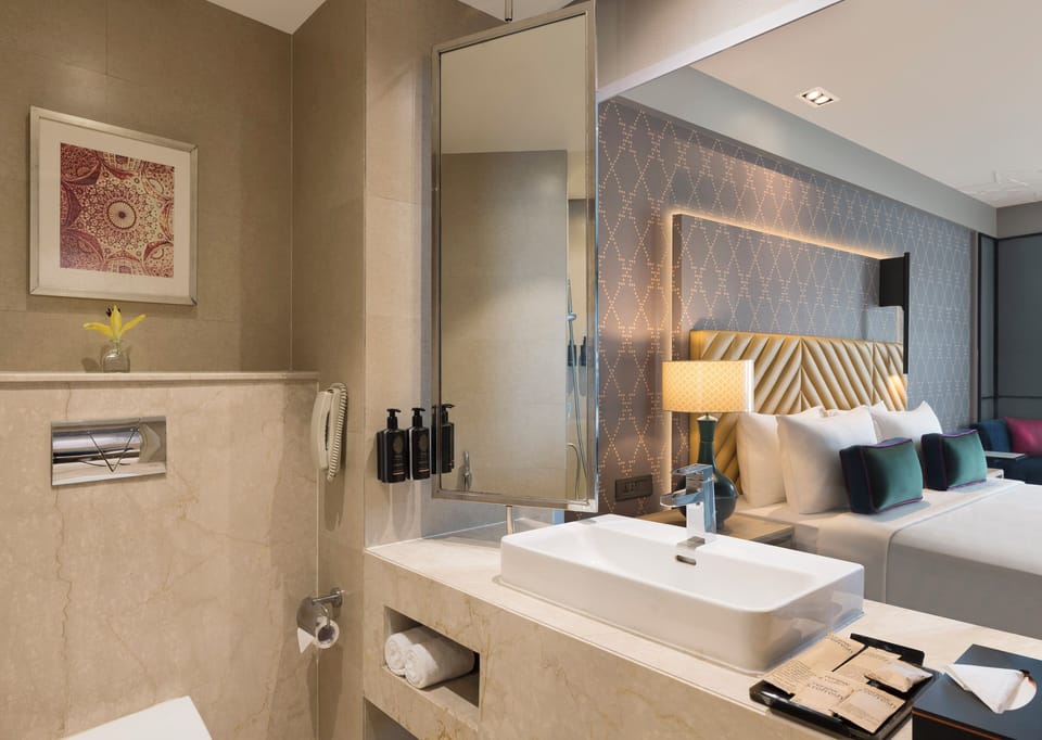 Eco-friendly toiletries, hair dryer, slippers, towels