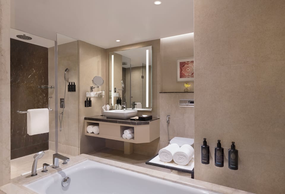 Junior Suite, 1 Double Bed | Bathroom | Eco-friendly toiletries, hair dryer, slippers, towels