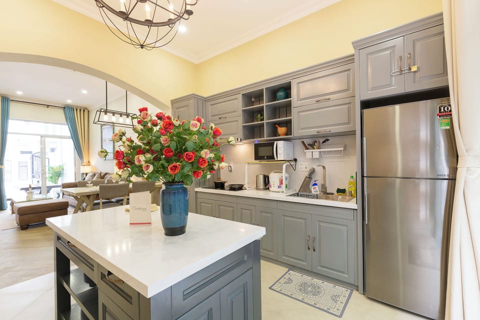 Villa, City View | Private kitchen | Stovetop, cleaning supplies, dining table