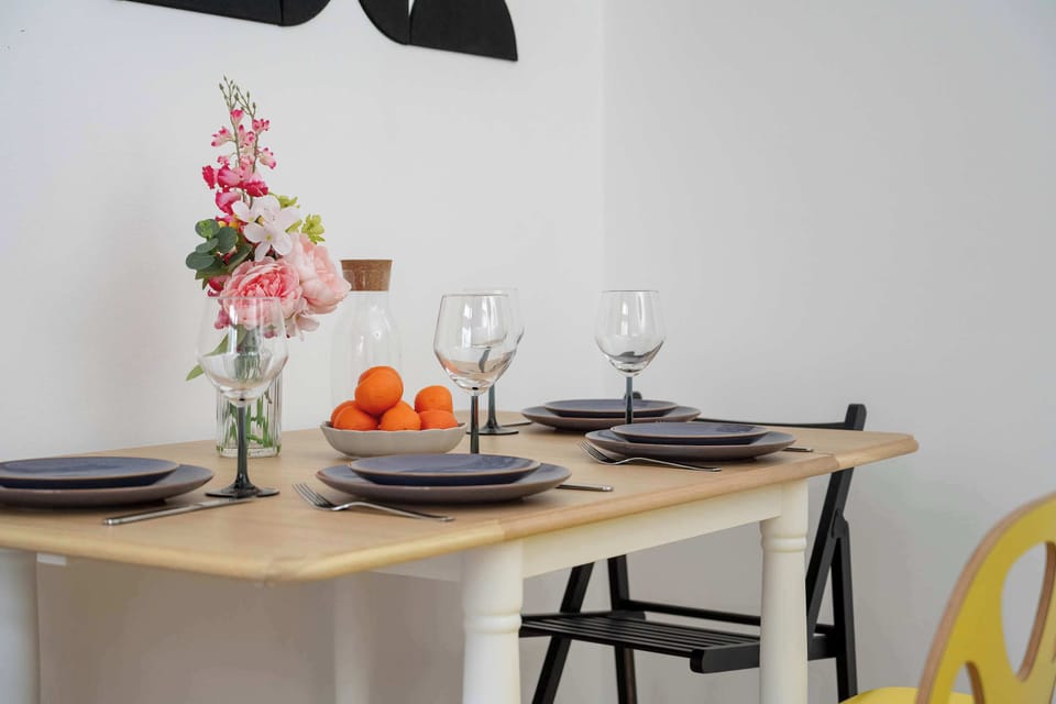 Close-up of the dining area with stylish tableware and decorative elements.