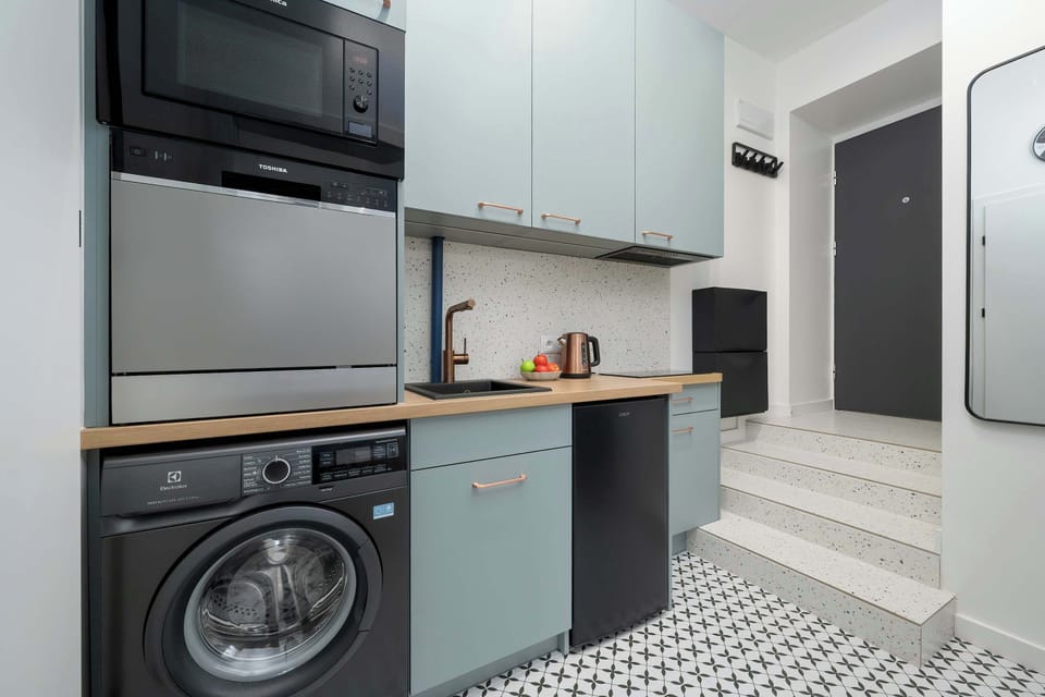 Kitchen space with modern cabinetry, cooktop, and compact design.