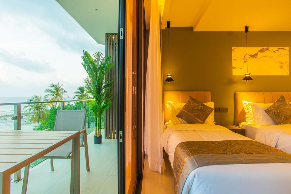 Deluxe Triple Room, Balcony, Sea View | Minibar, in-room safe, desk, laptop workspace