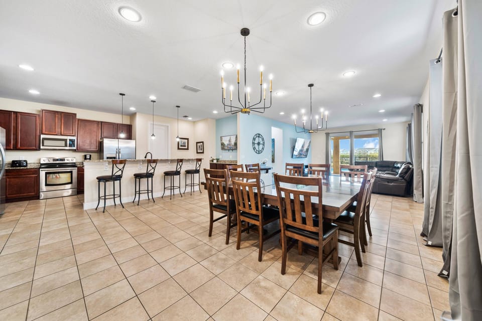 Open-concept kitchen & dining area w/ spacious layout for gathering & meals