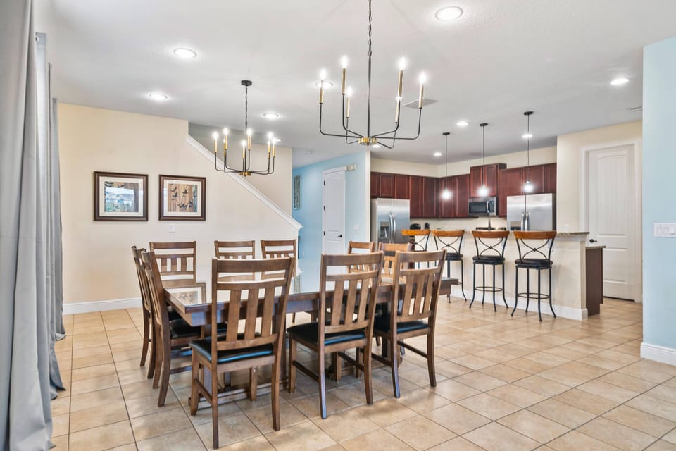 Spacious dining area w/ stylish lighting & easy access to the kitchen