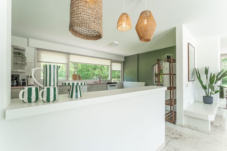 Bright interior with large windows connecting indoor comfort to the beautiful outdoor landscape.