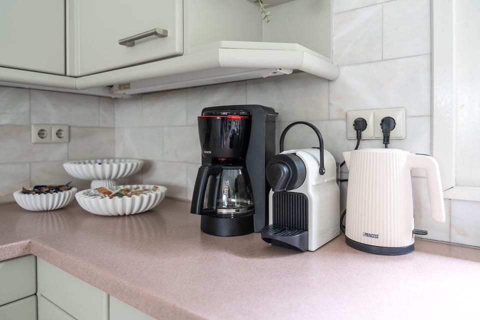Coffee corner with Nespresso machine in a fully equipped holiday villa for 14 guests near Tilburg.