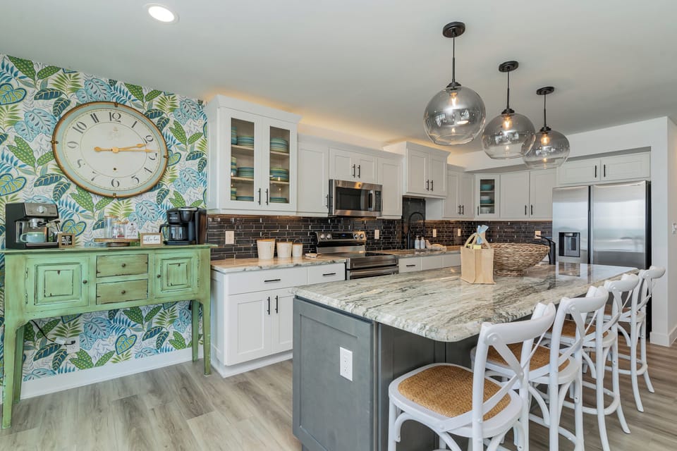 Your gourmet kitchen awaits with granite counters, stainless appliances, and a breakfast bar perfect for morning coffee or evening wine.