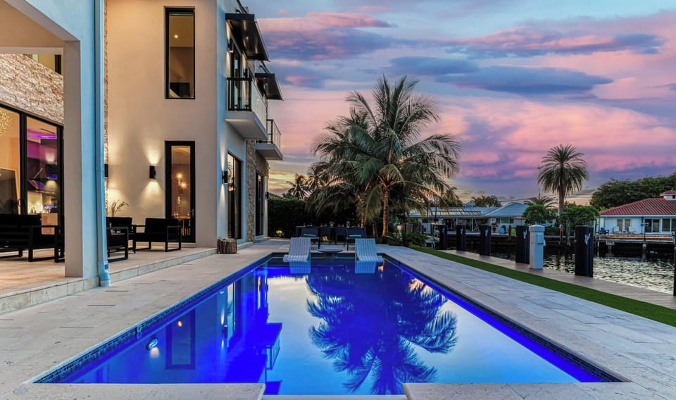 Stunning Heated Salt Water Pool/Hot Tub overlooking 100ft of Waterfront in Coral Ridge Country Club Estates.