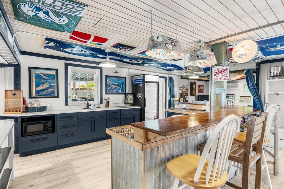 rustic kitchen with a wooden bar and nautical decor for a cozy gathering space