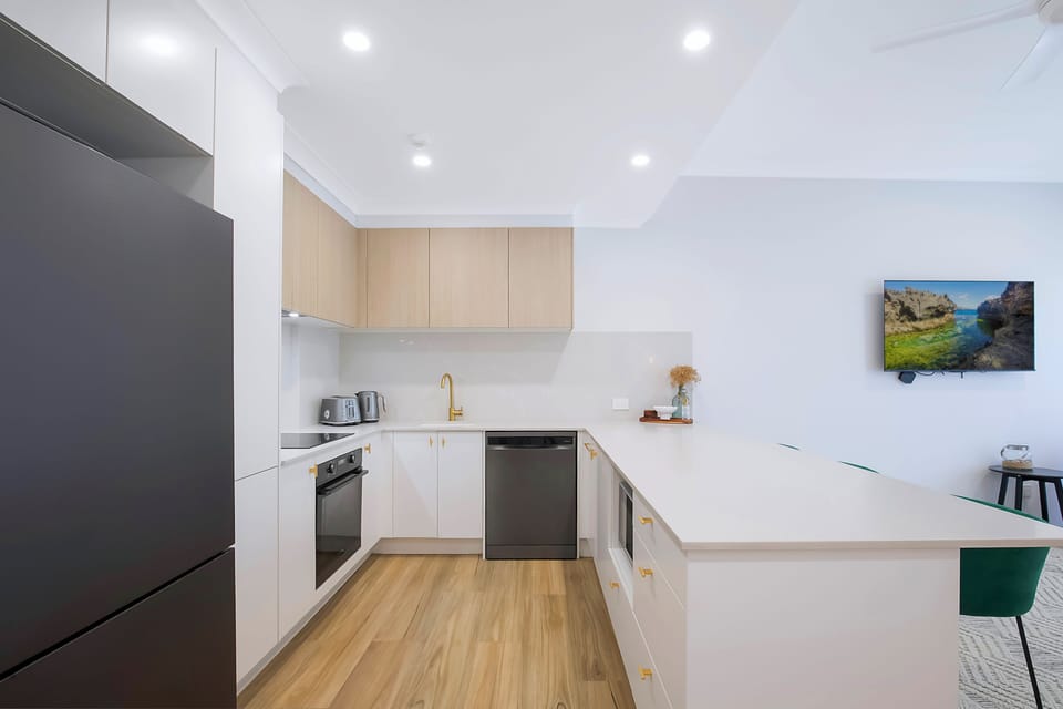 The kitchen features modern appliances and generous bench space, making simple at-home meals effortless.