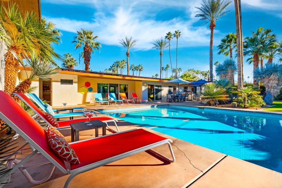 Poolside lounge beds invite you to soak up the sun and unwind in total comfort.