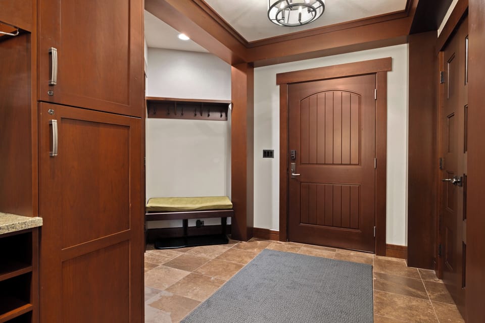 The condo's entrance foyer has plenty of space to store jackets.