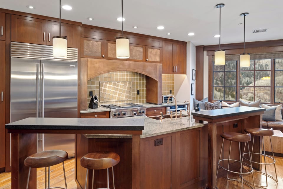 The kitchen is loaded with appliances, fully equipped, and has an eat-in island