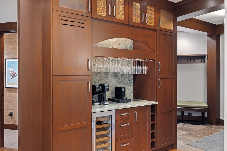 The bar area comes stocked with extensive barware and great coffee makers