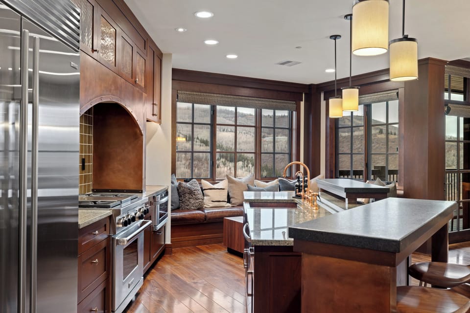 The kitchen is loaded with appliances, fully equipped, and has an eat-in island