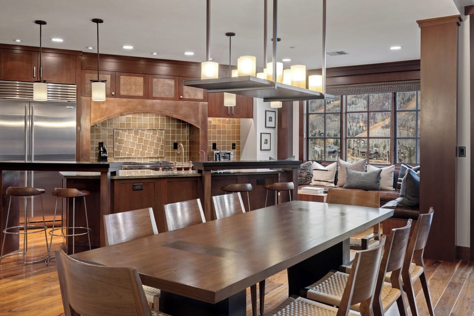 DIning table with seating for 8 plus seating for 4 more at the island